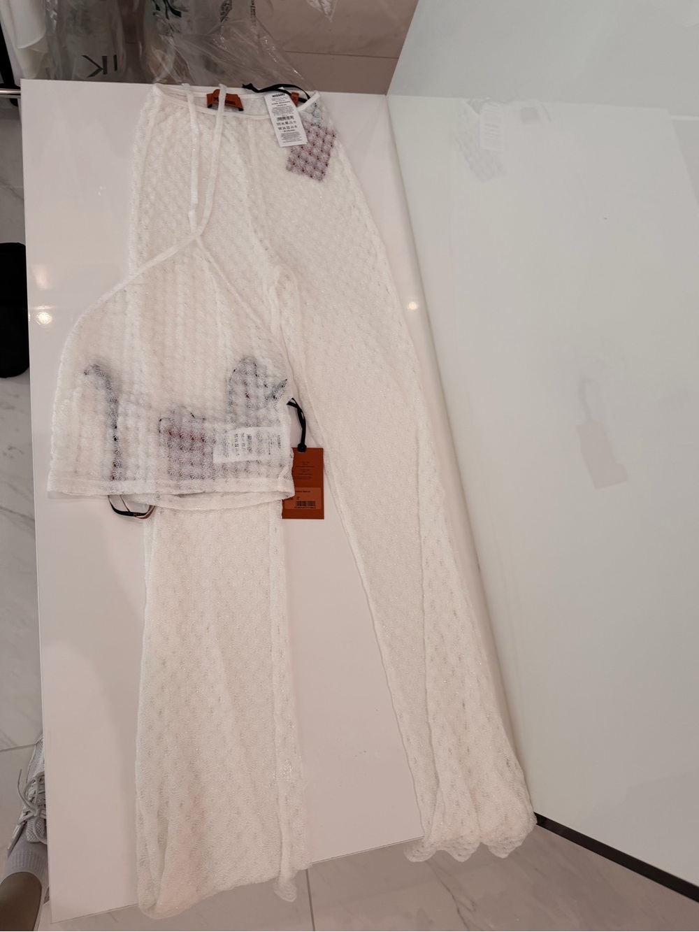 Missoni 
Top and bottom in lamé viscose with raschel workmanship